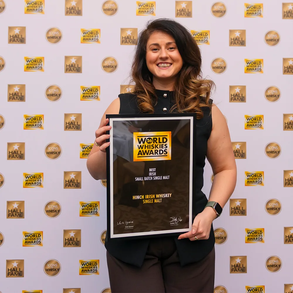 Emma with award for hinch single malt